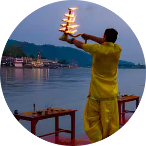 Priest performing the evening Ganga Aarti ceremony on the banks of the Ganges River.