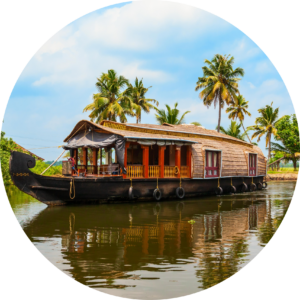 Traditional Kerala houseboat cruising peacefully through the backwaters surrounded by coconut palms.