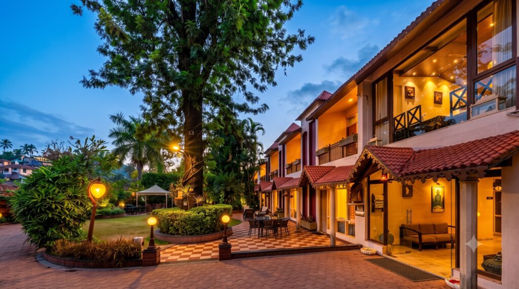 Comfortable budget hotel in India with modern rooms, landscaped gardens, and outdoor seating.